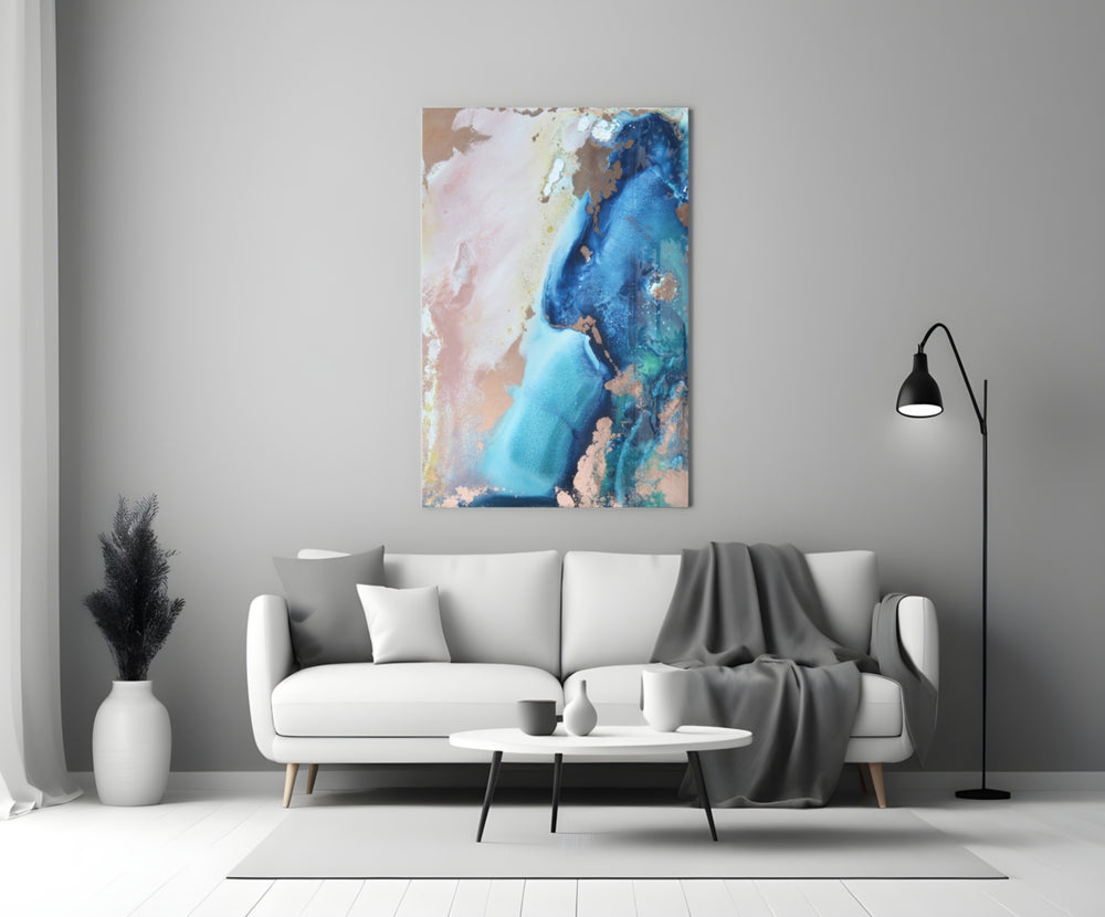 Abstraction glass wall art styled above a console in a living room