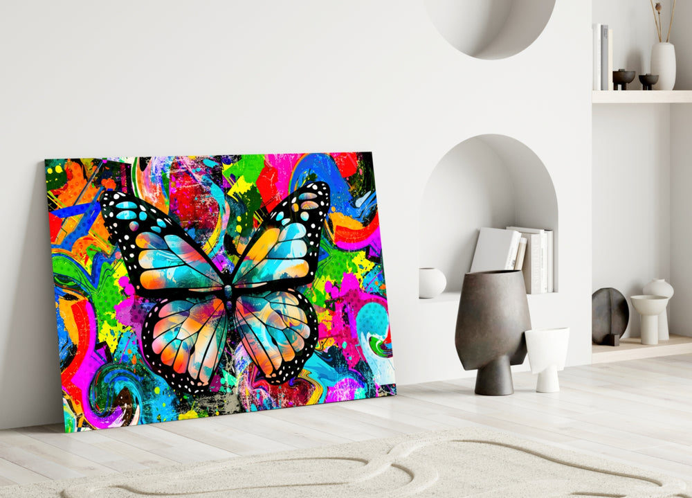 Butterfly glass wall art styled above a sofa in a kids room