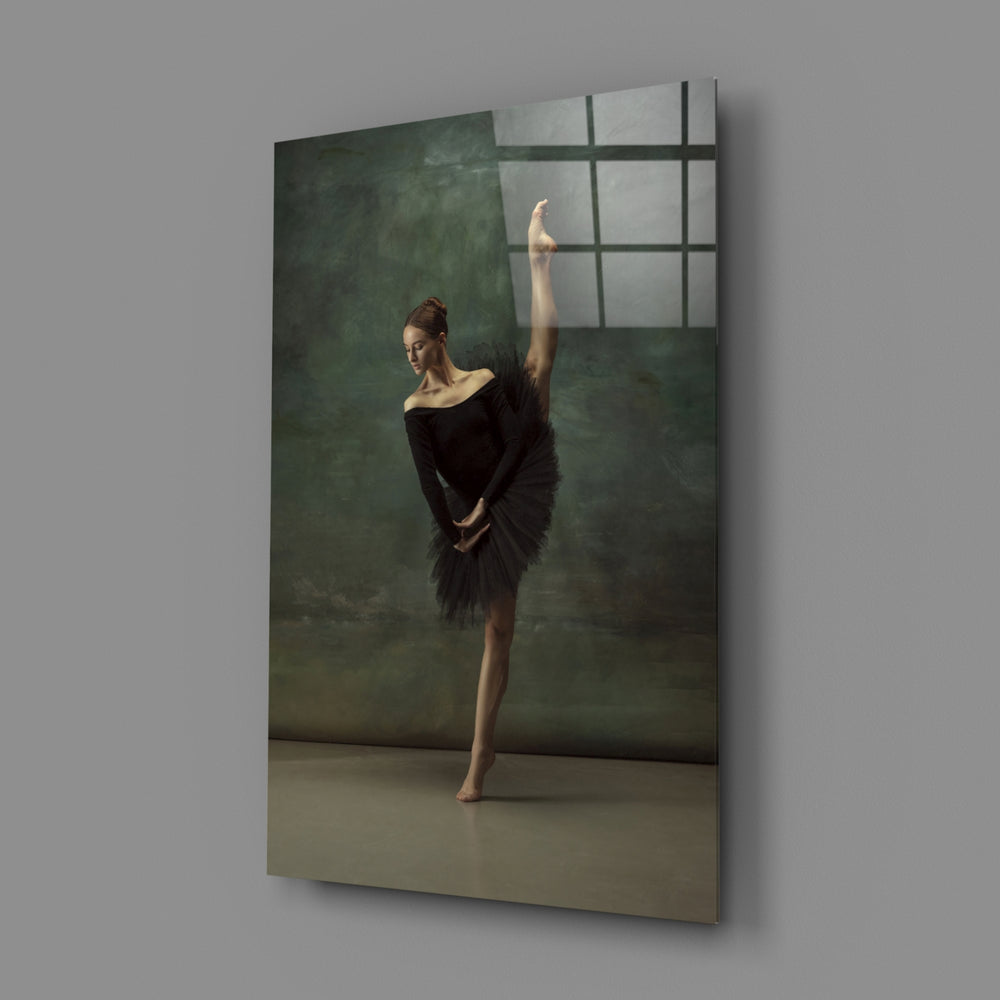 Ballerina close-up showing black-tutu dancer arched in teal smoke