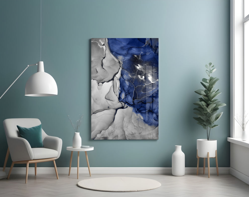 Blue Marble glass wall art styled above a bed in a bedroom