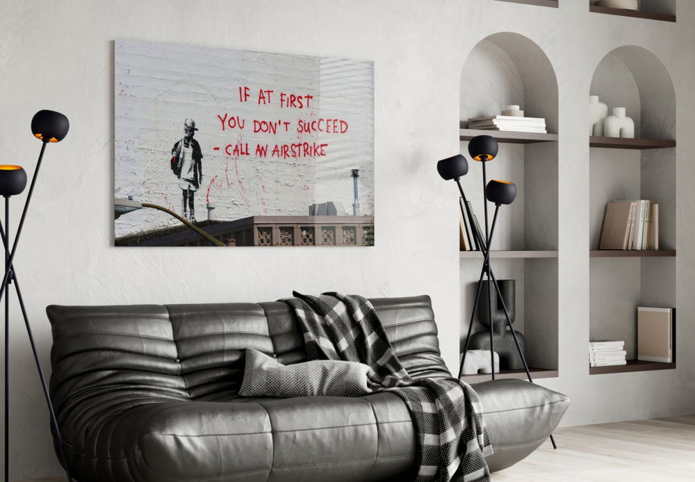 If you failed glass wall art styled above a sofa in a living room