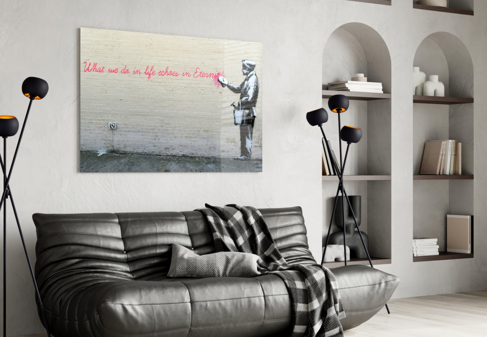 What We Do in Life glass wall art styled above a console in a hallway