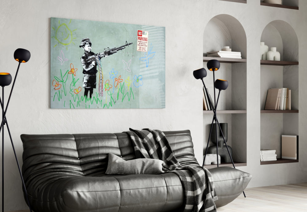 Child and War glass wall art styled above a sofa in a living room
