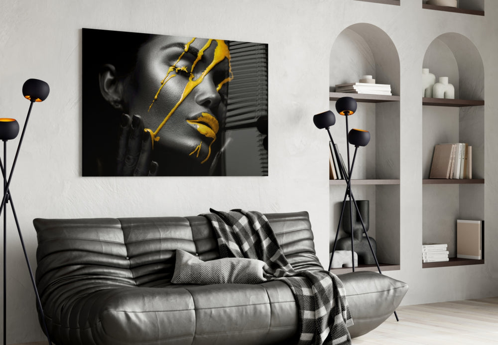 Yellow Paint glass wall art styled above a bed in a bedroom