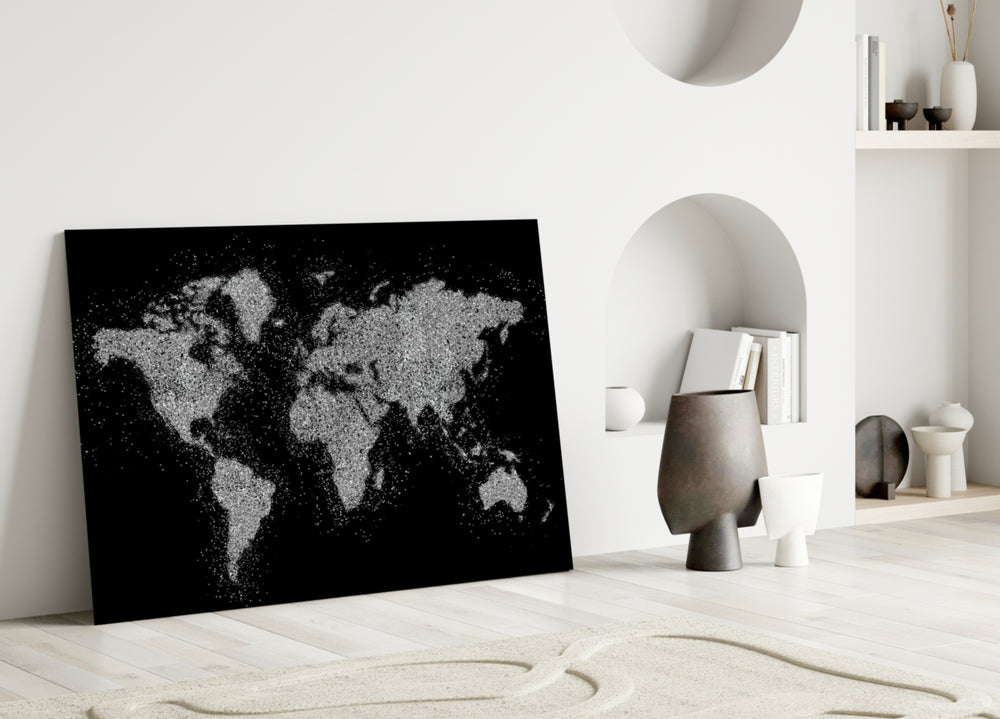 World Map close-up showing silver-glitter continents on deep onyx