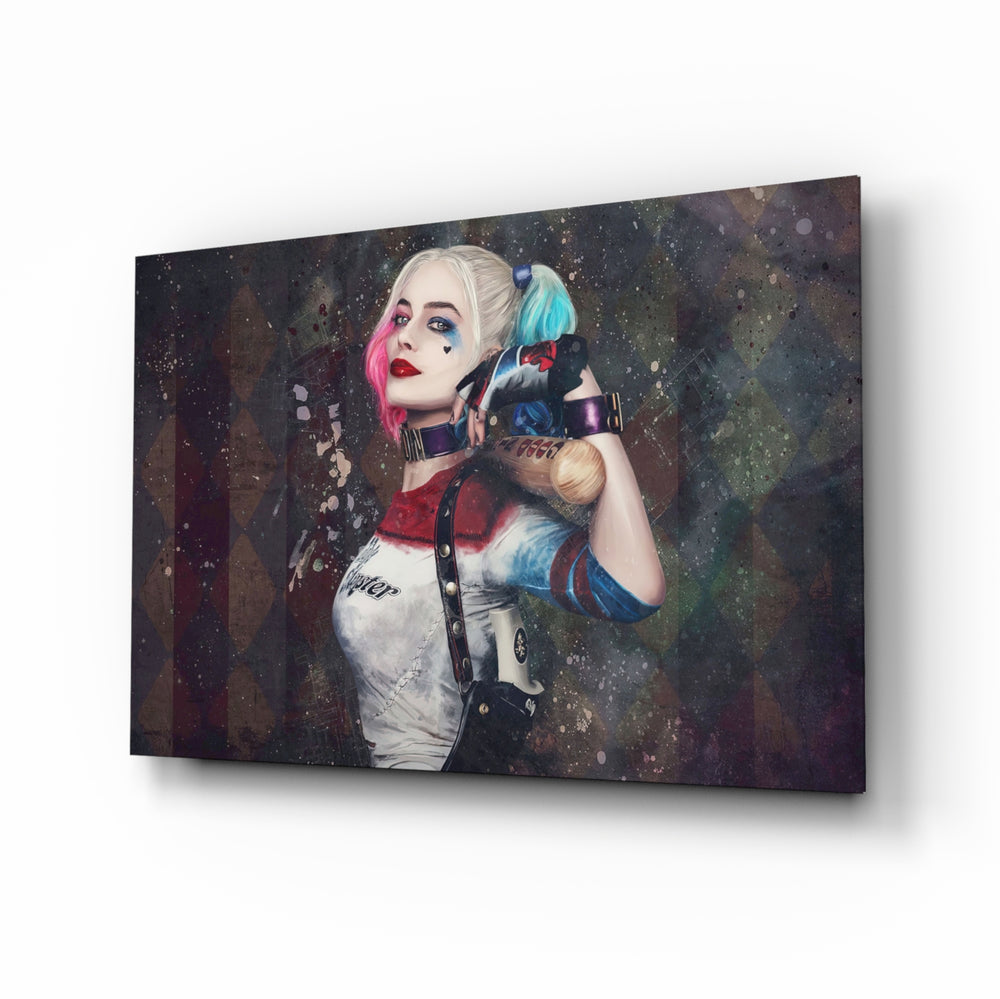 Harley Quinn glass wall art displayed above a charcoal sofa in a slate-walled office lounge with steel desk and matte-black shelving