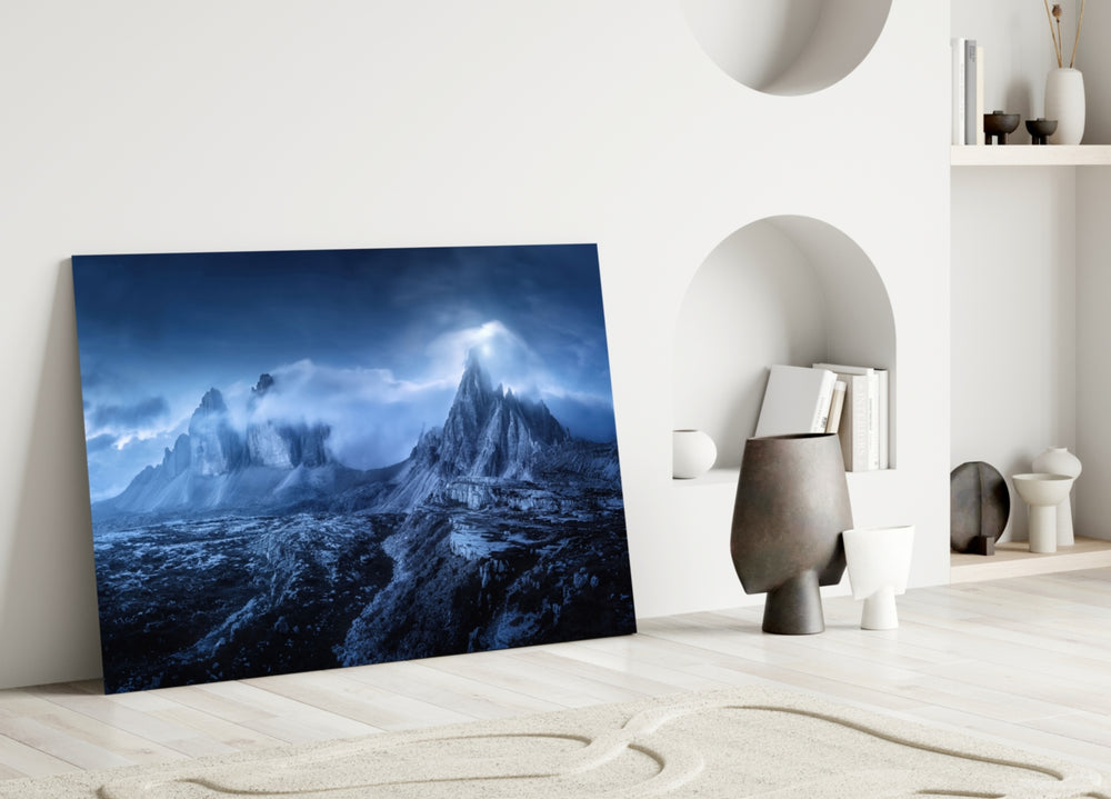 Imposing Mountains close-up showing twin Dolomite peaks under storm-veiled cobalt night