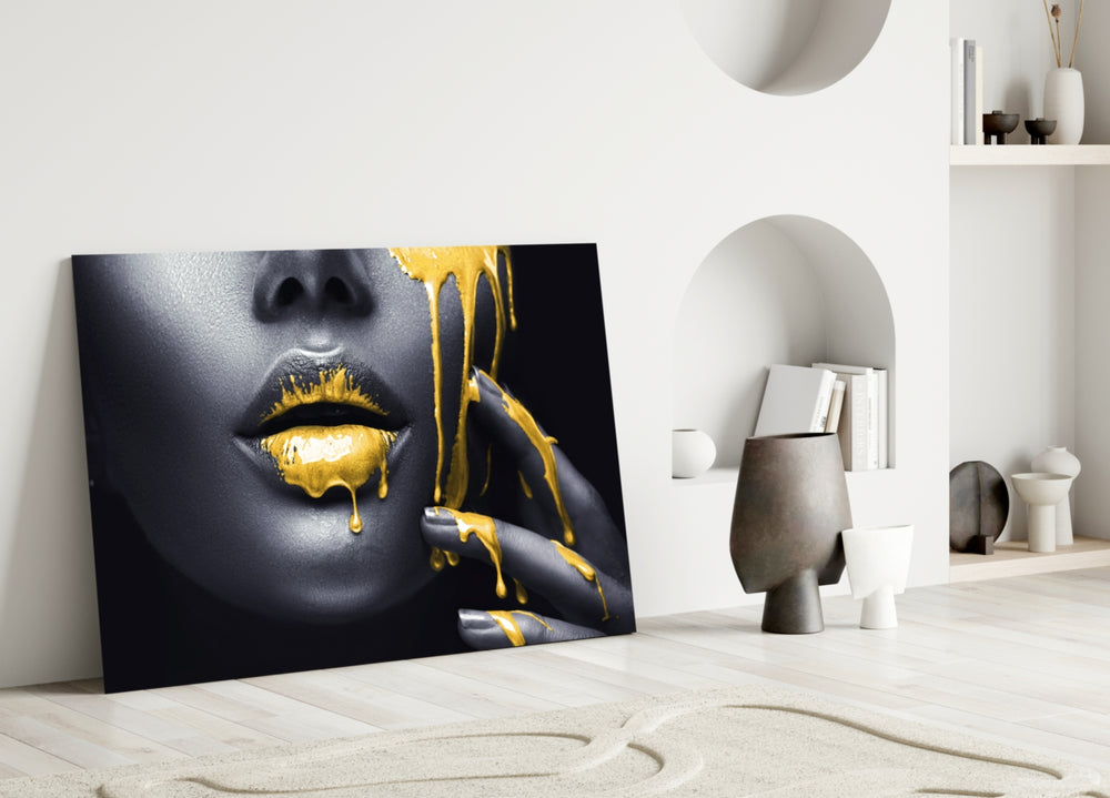 Yellow Lips close-up showing molten gold drip across graphite-painted lips and fingertips