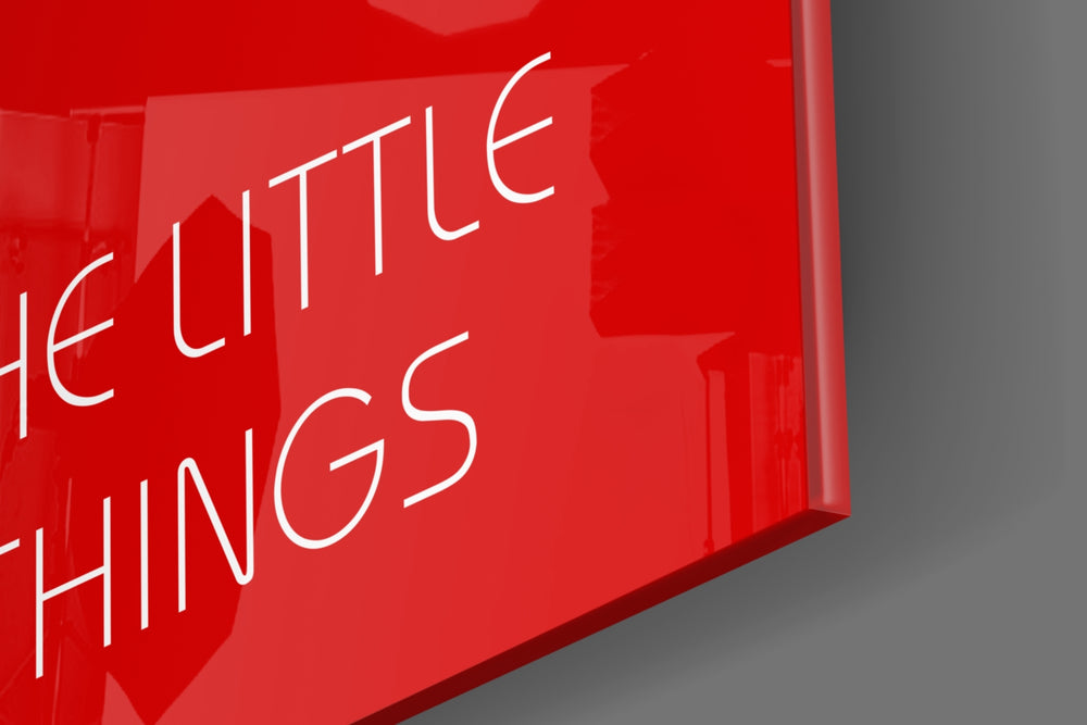 Enjoy The Little Things artwork anchoring a wall with bold motivational palette