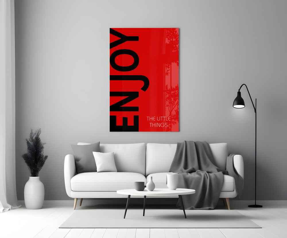 Enjoy The Little Things close-up showing onyx ENJOY type on crimson field with pale tagline