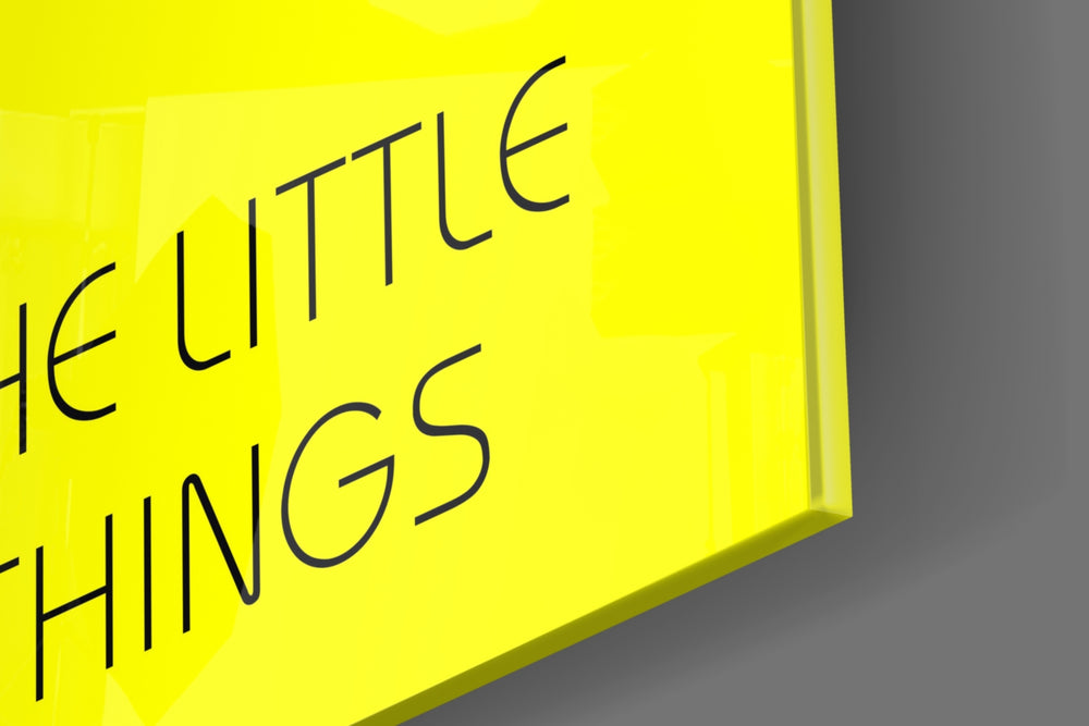 Enjoy The Little Things artwork anchoring a wall with bright motivational palette