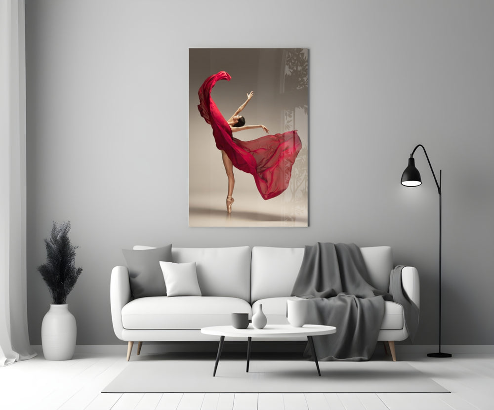 Ballerina close-up showing dancer en pointe with crimson silk swirling above arched back
