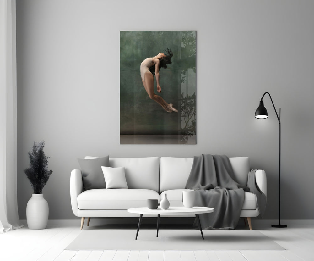 Ballerina close-up showing dancer mid-leap with hair fanned and head thrown back