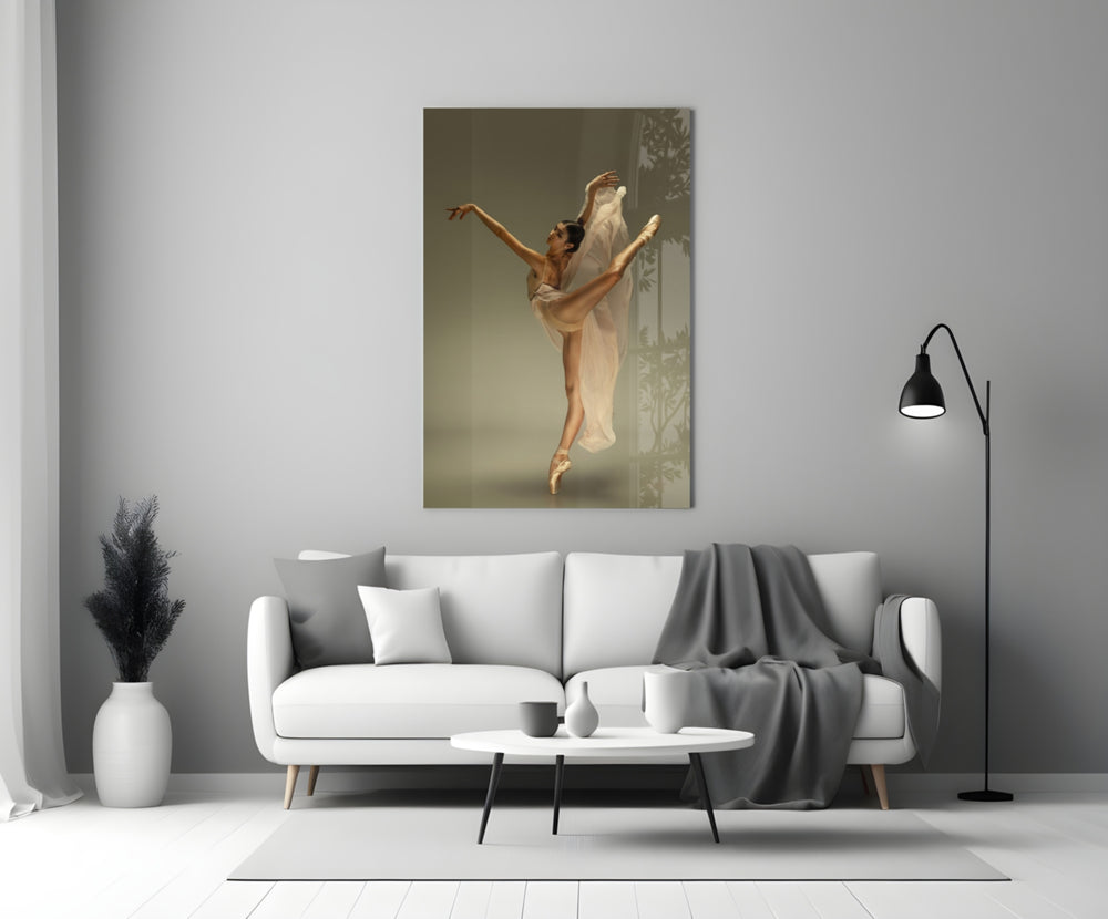 Ballerina close-up showing high arabesque with cream chiffon trailing from wrist