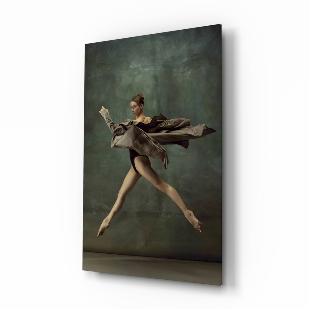 Ballerina glass wall art displayed beside a charcoal sofa in a moss-painted hallway with herringbone floor and brass picture light