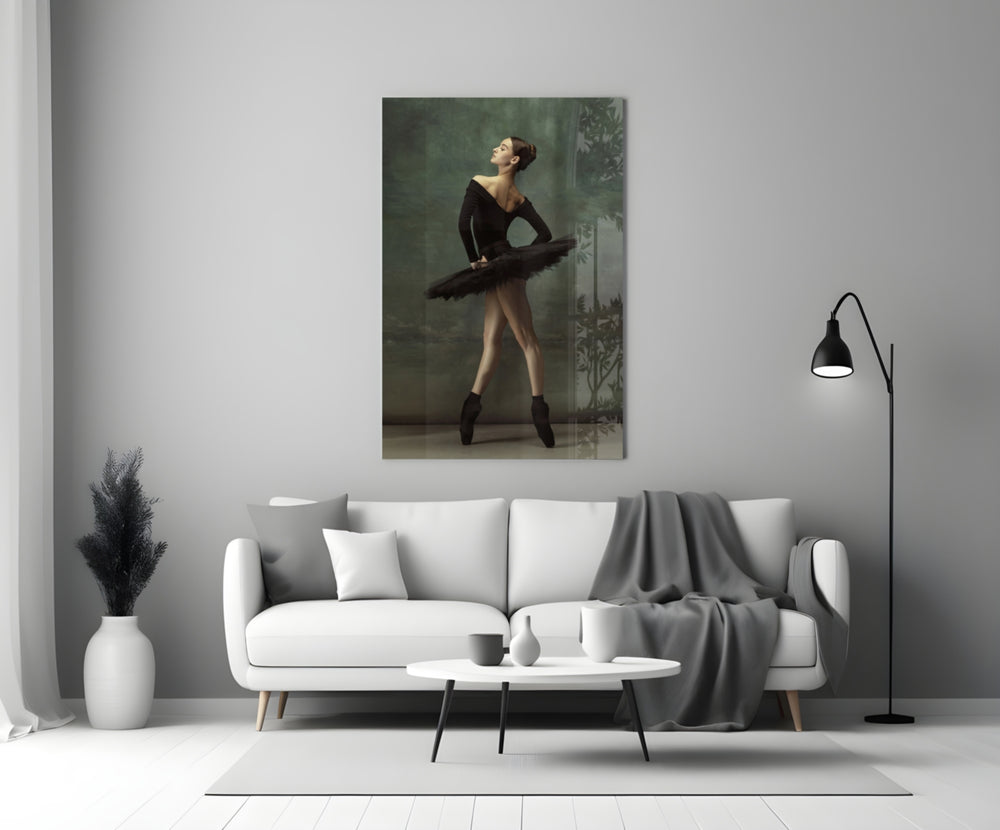Ballerina close-up showing black-tutu dancer in profile en pointe