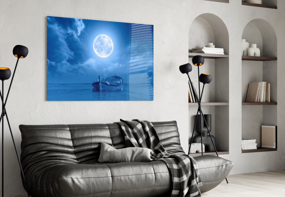 Moon and Boat glass wall art styled above a bed in a bedroom