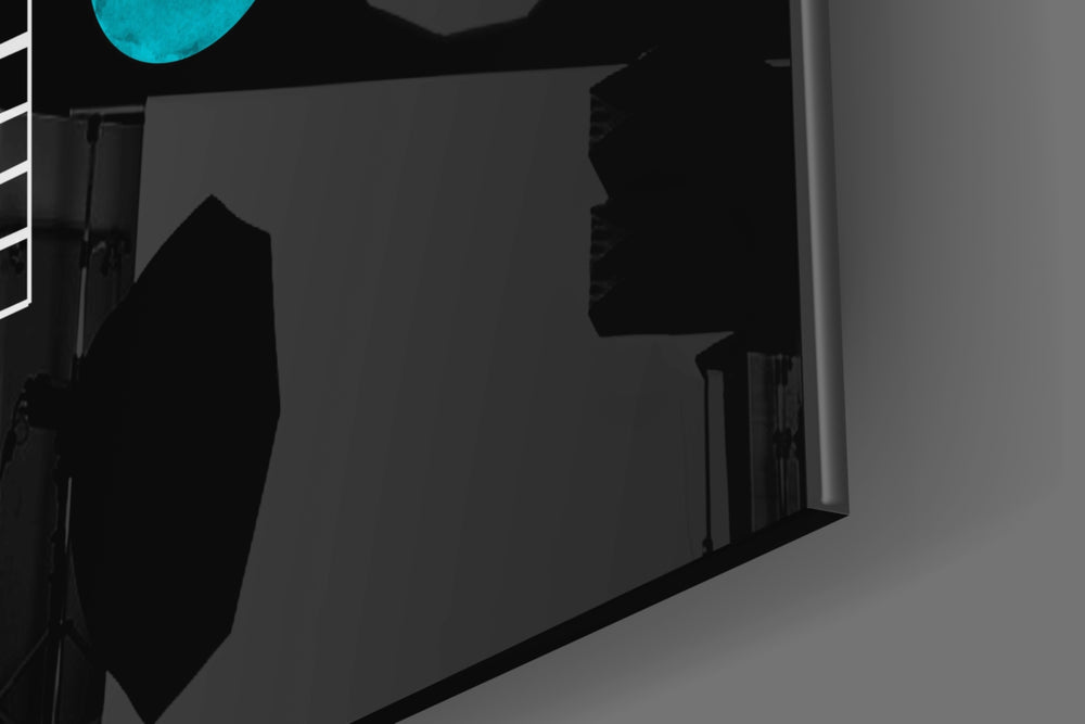 Pattern artwork anchoring a wall with dark minimalist palette