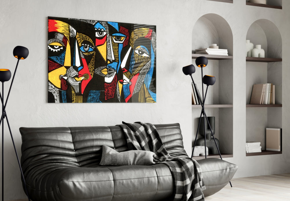 Faces glass wall art styled above a console in a hallway