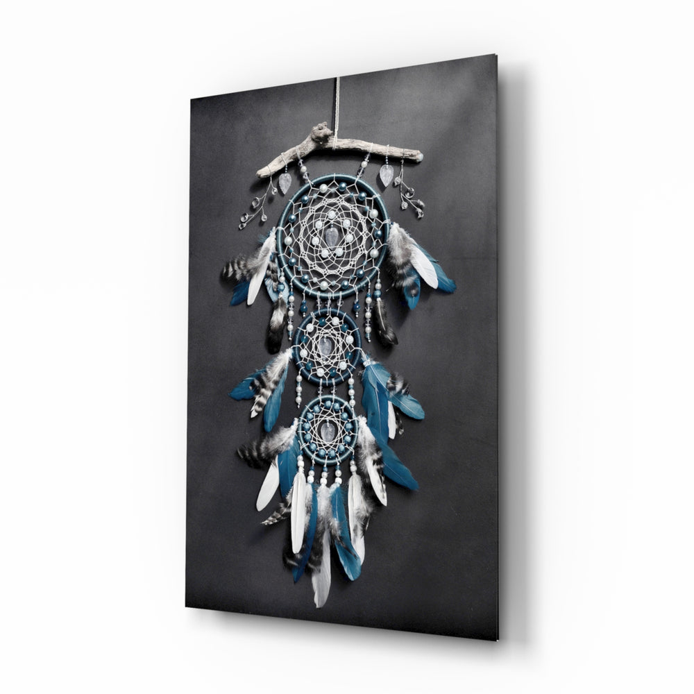 Dreamcatcher glass wall art displayed beside a charcoal velvet bed in a slate bedroom with brushed-brass sconces and rattan nightstands