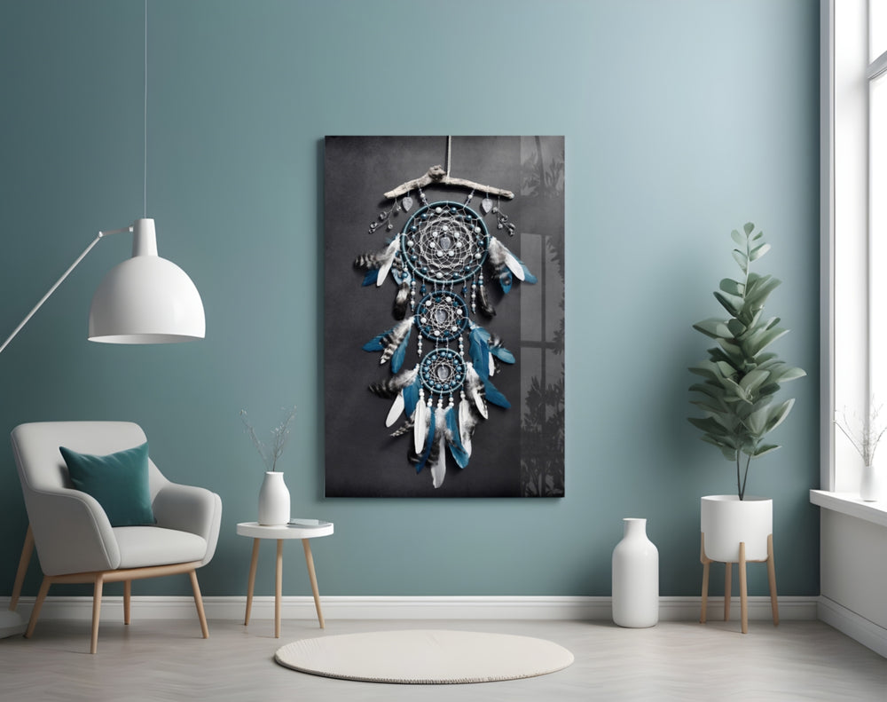 Dreamcatcher glass wall art styled above a bed in a bedroom