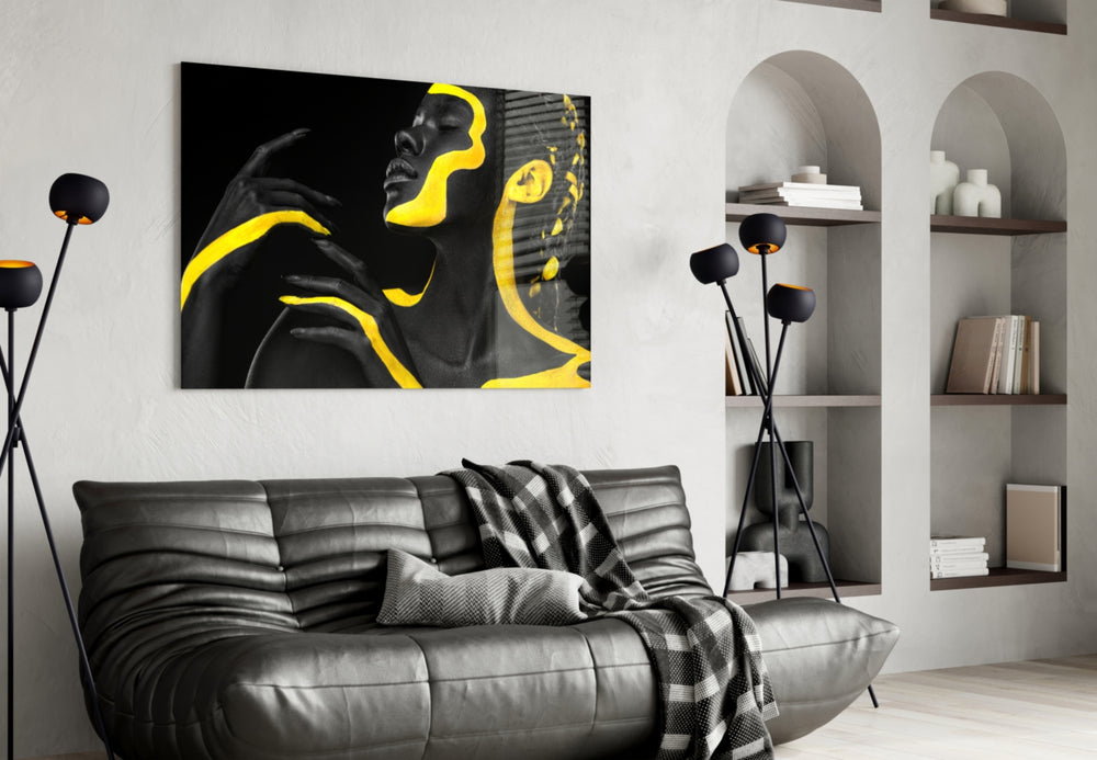 Yellow Woman glass wall art styled above a console in a hallway