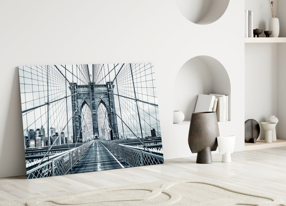 Brooklyn Bridge close-up showing pedestrian walkway and cable fan toward stone tower