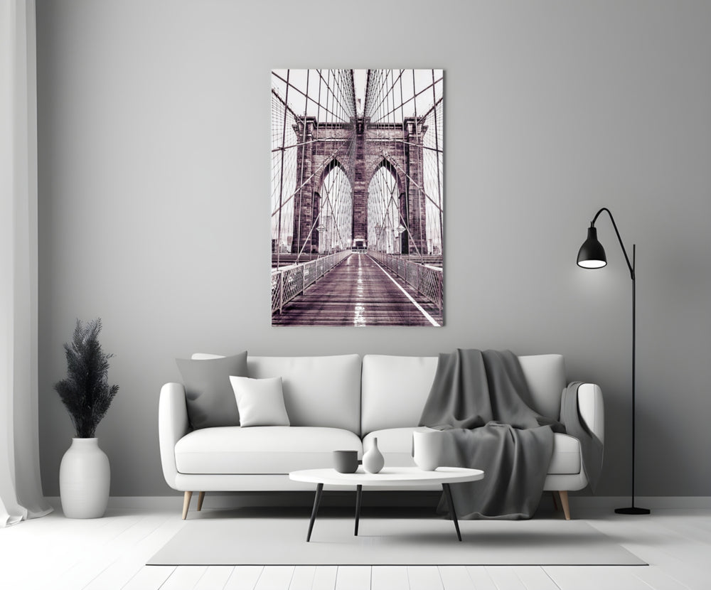 Brooklyn Bridge close-up showing pedestrian walkway and twin gothic arches in mauve mono