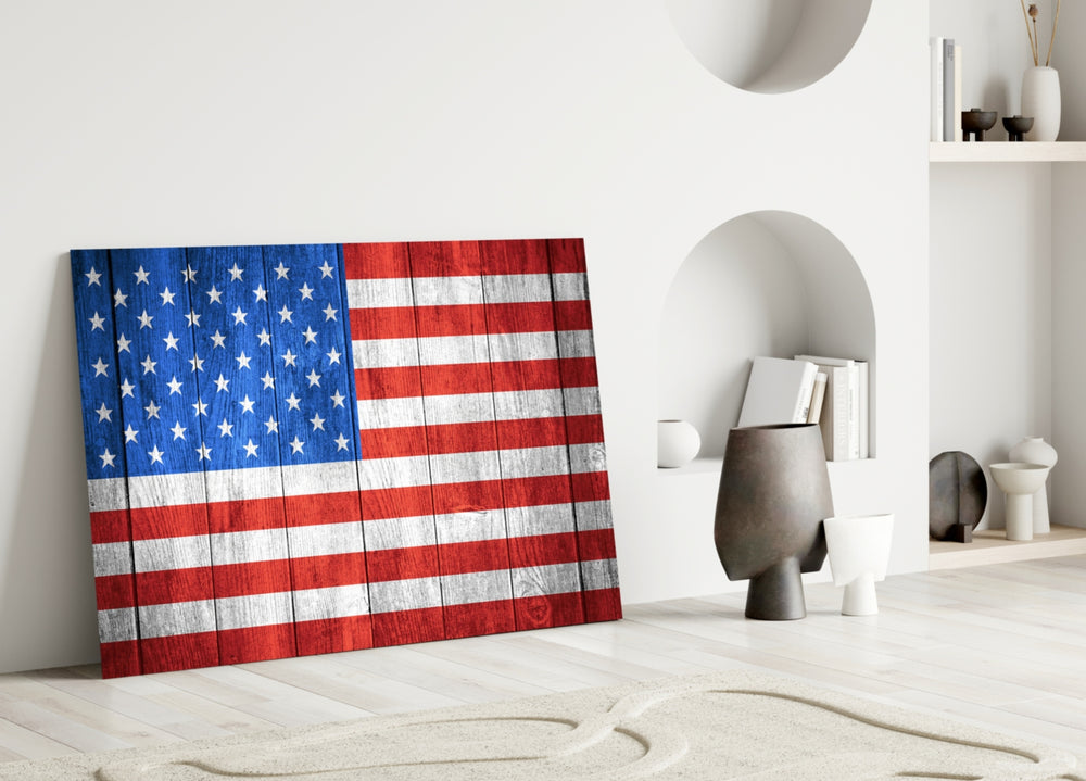 Flag of the United States close-up showing stars and stripes painted across wood planks
