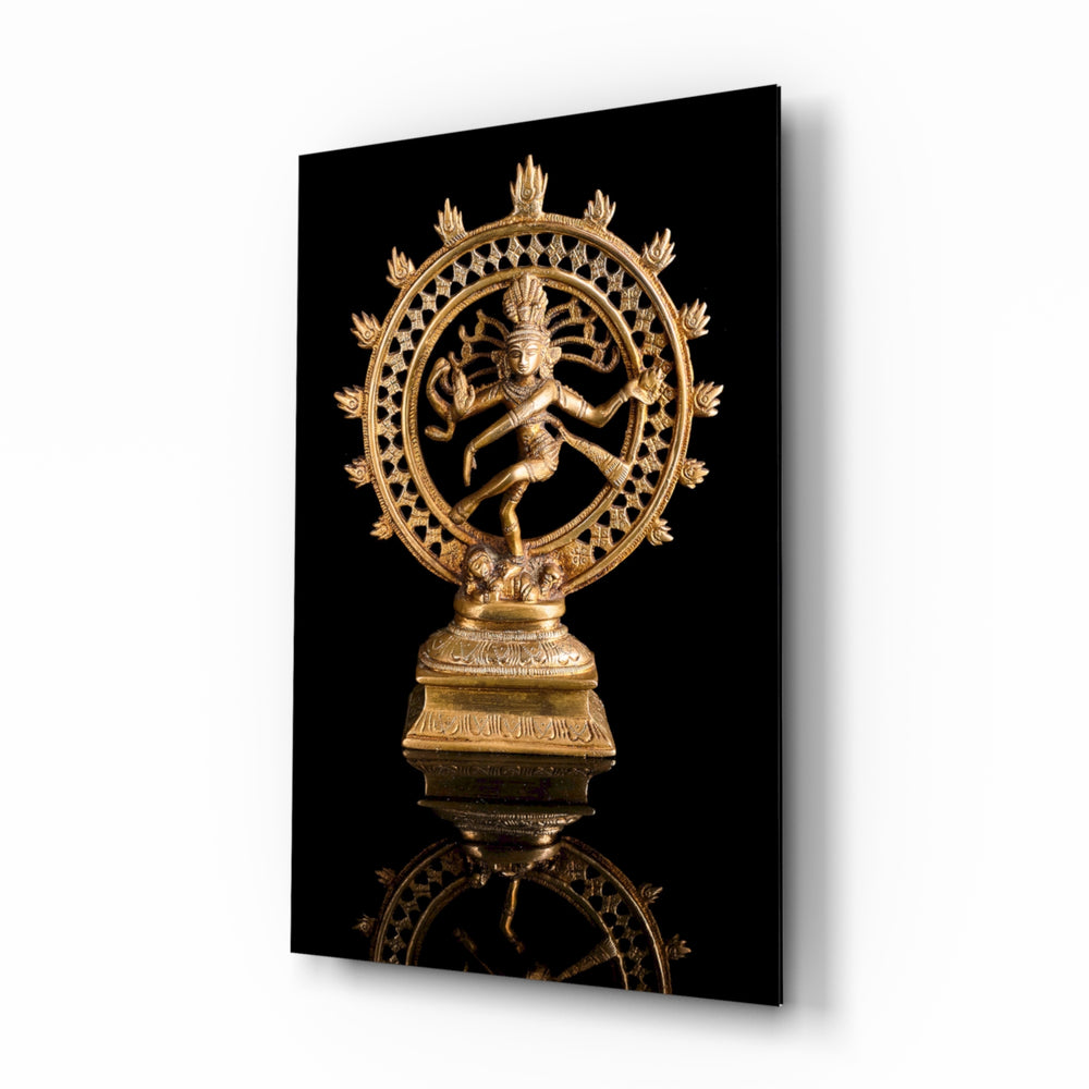 Shiva Nataraja glass wall art displayed above a black leather sofa in a moody lounge with walnut console and brass arc lamp
