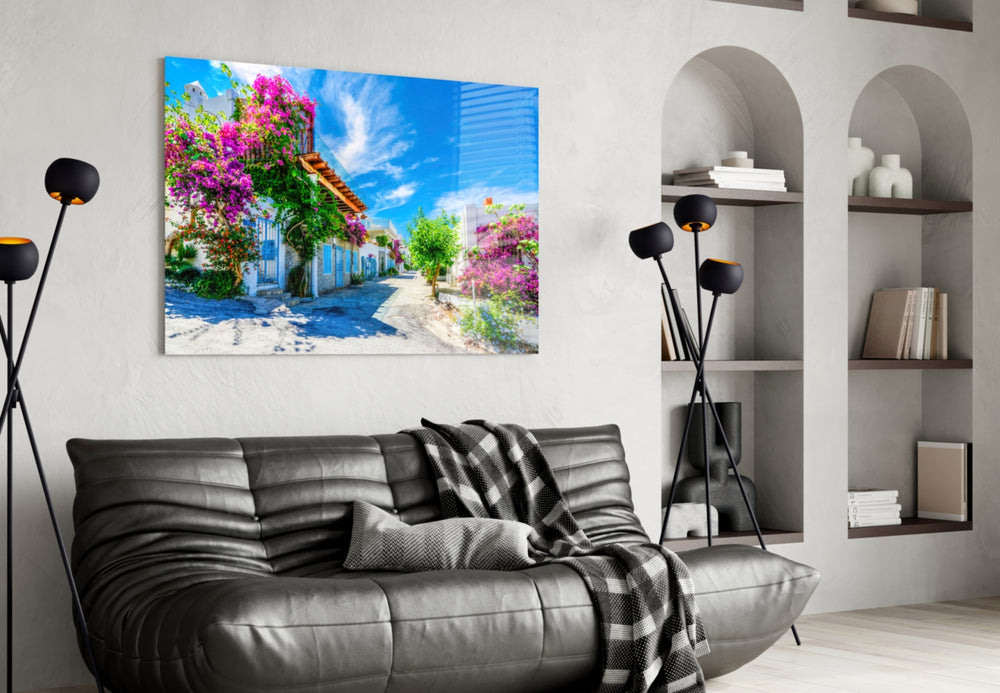 Aegean Beauties glass wall art styled above a bed in a bedroom
