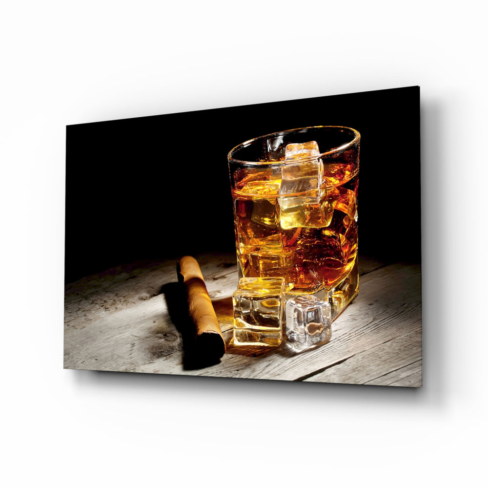 Whiskey glass wall art displayed above a leather chesterfield in a moody man cave with reclaimed-wood console and brass arc lamp