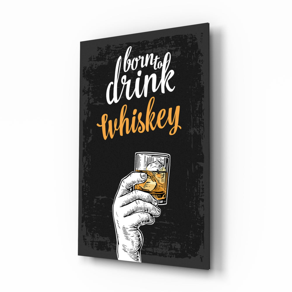 Whiskey glass wall art displayed above a leather chesterfield in a moody man cave with reclaimed-wood console and brass arc lamp