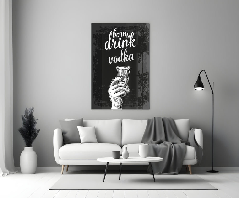 Vodka close-up showing Born to Drink script with hand raising clear shot
