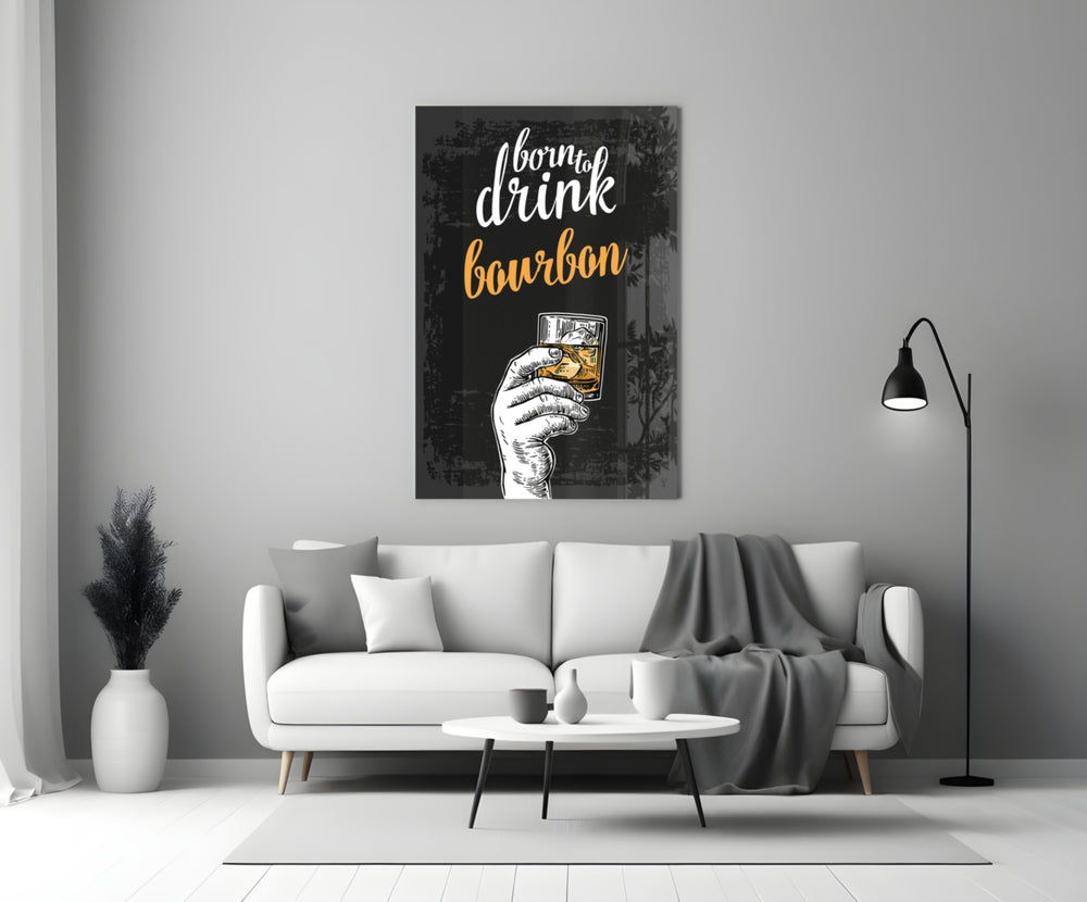 Bourbon close-up showing Born to Drink script with hand raising amber rocks glass