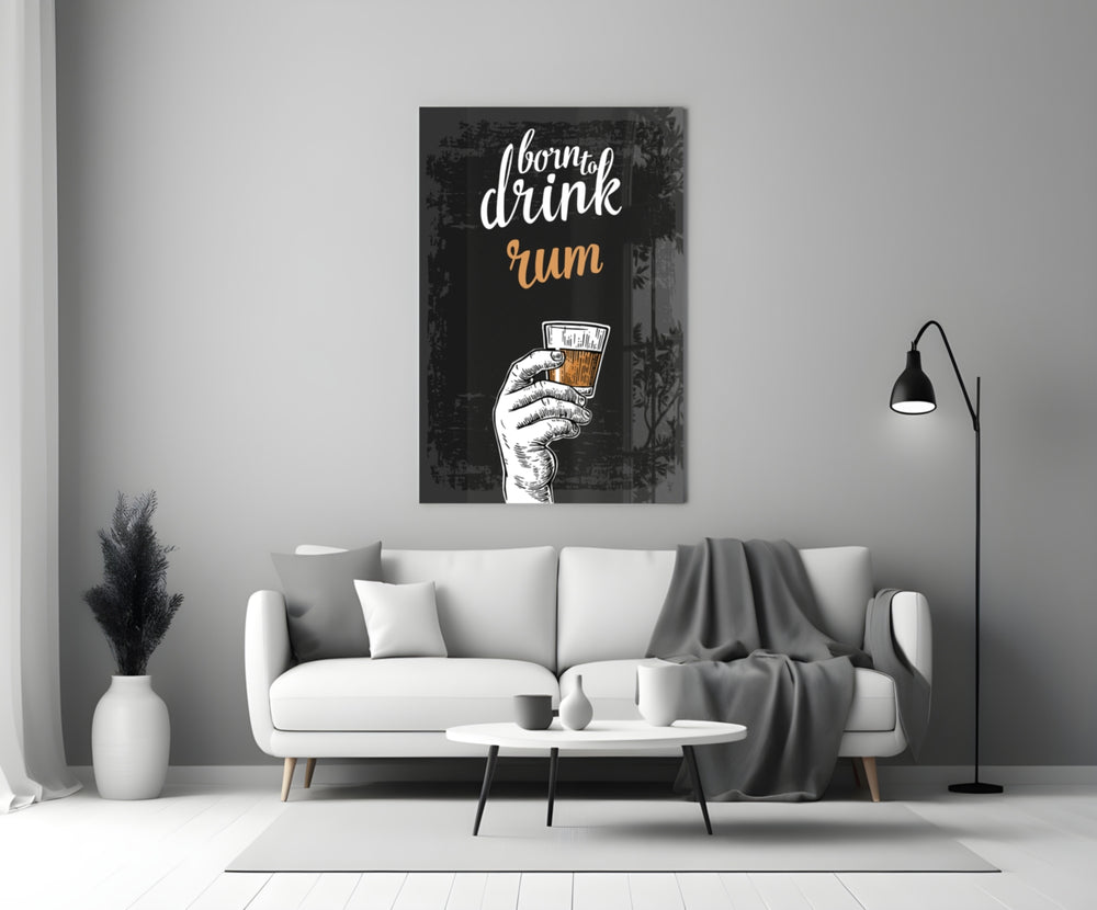 Rum close-up showing Born to Drink script with hand raising caramel rum shot