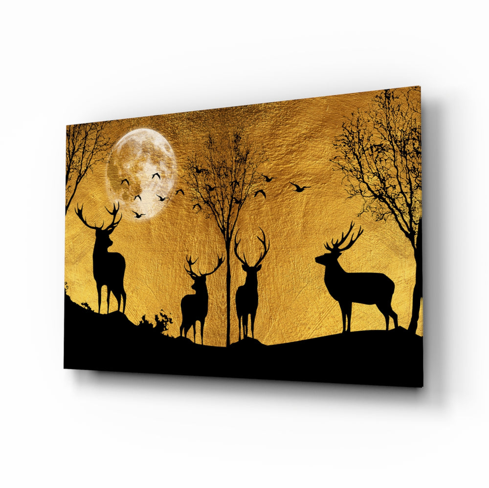 Deers glass wall art displayed above a linen bed in a warm bedroom with rattan nightstands and brushed-brass sconces