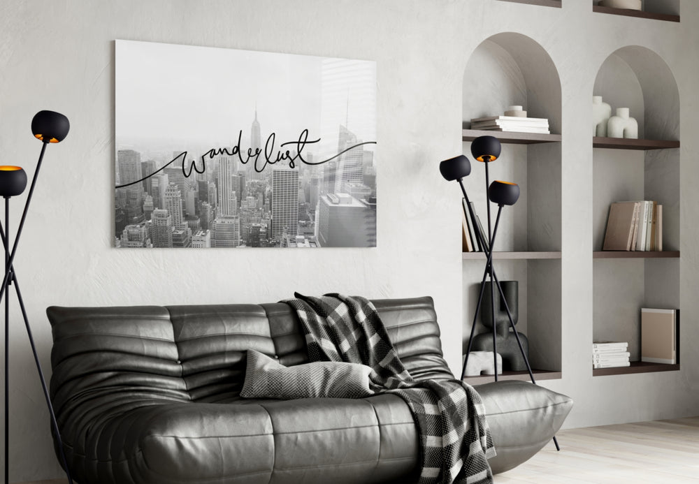 Wanderlust glass wall art styled above a desk in an office