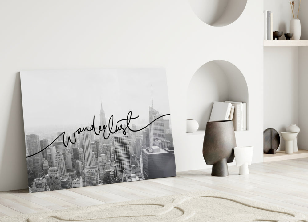 Wanderlust close-up showing flowing cursive across NYC monochrome skyline