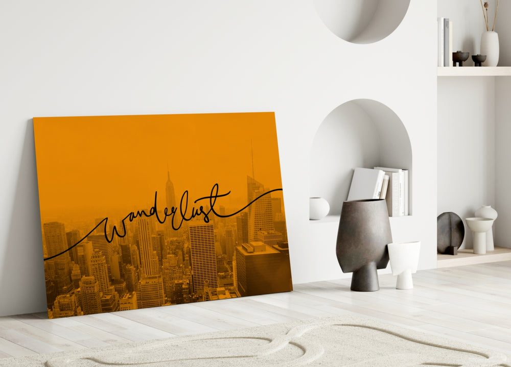 Wanderlust close-up showing flowing cursive across marigold-tinted NYC skyline