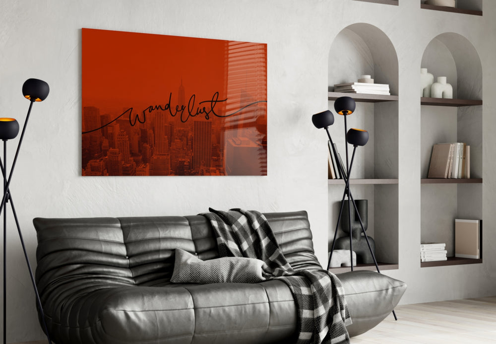 Wanderlust glass wall art styled above a desk in an office