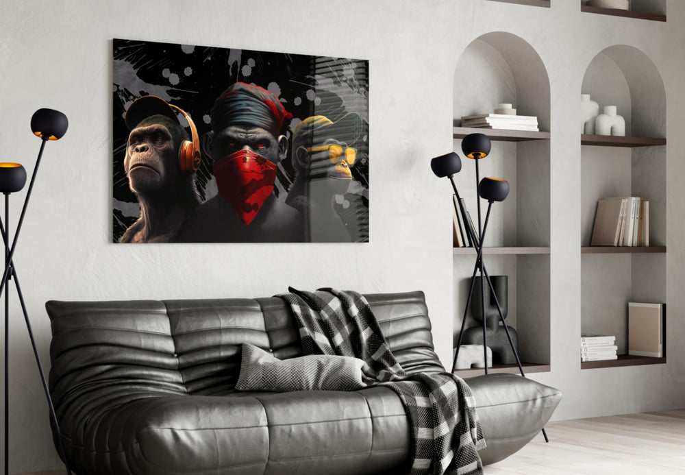 3 Wise Monkeys glass wall art styled above a desk in a study