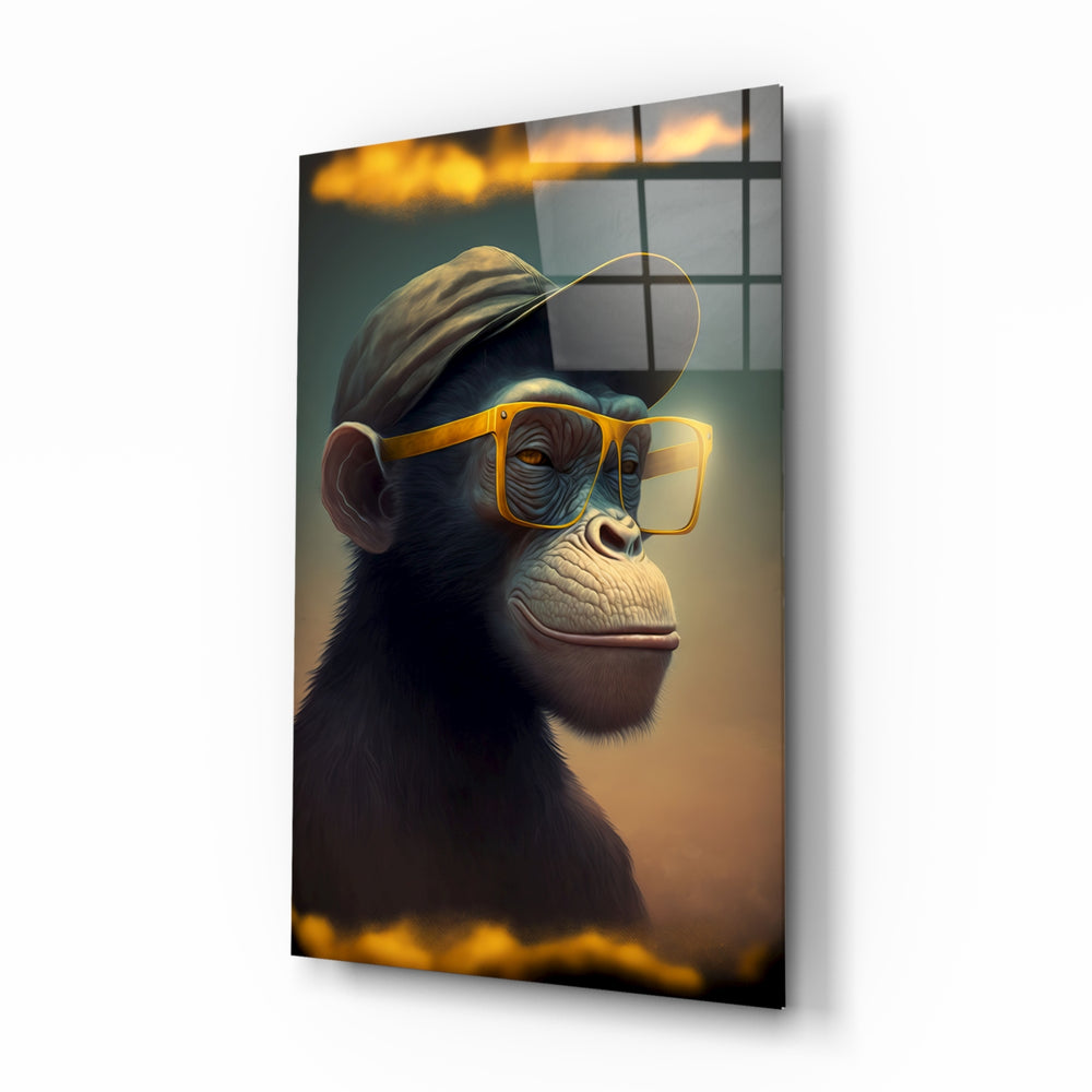 Wise Monkey glass wall art displayed above a walnut desk in a moody home office with brass sconces