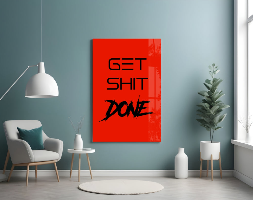 Get Shit Done glass wall art styled above a console in a study