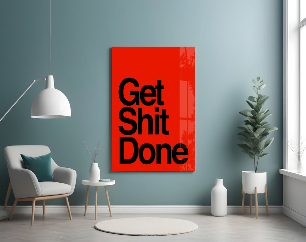 Get Shit Done glass wall art styled above a console in a startup lounge