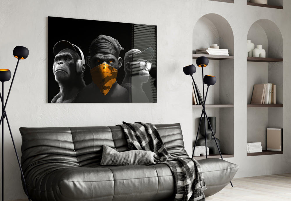 3 Wise Monkeys glass wall art styled above a console in a study