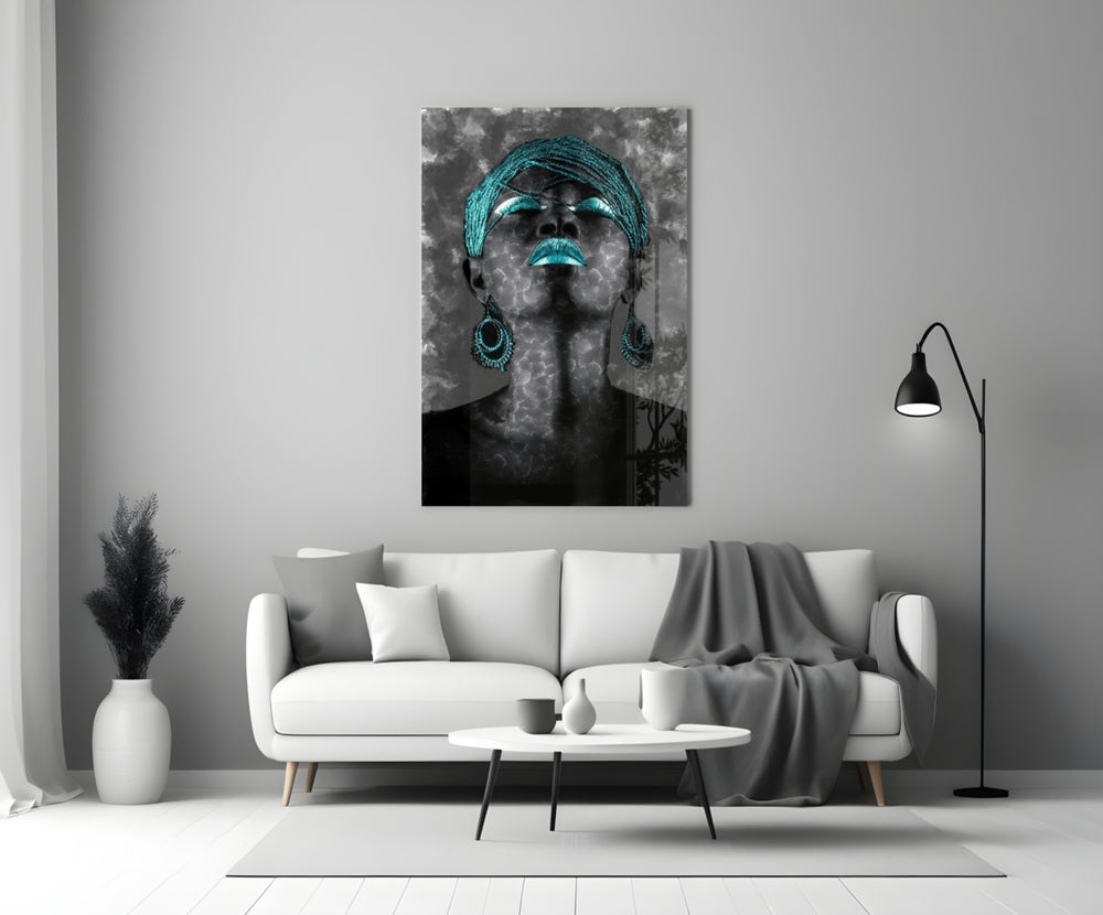 Women close-up showing teal braided headwrap, teal lips and teardrop earrings