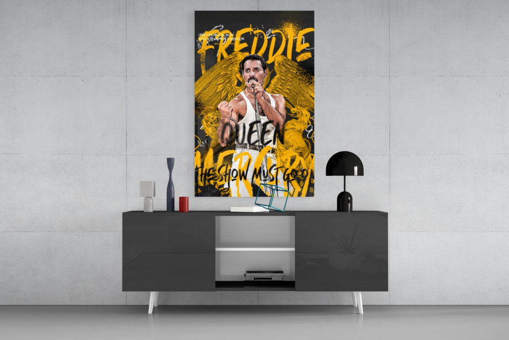 Freddie panel catching lamp light to reveal its show-must-go-on collage