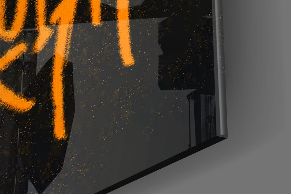 Cartoon-notation artwork anchoring a wall with onyx-and-tangerine palette