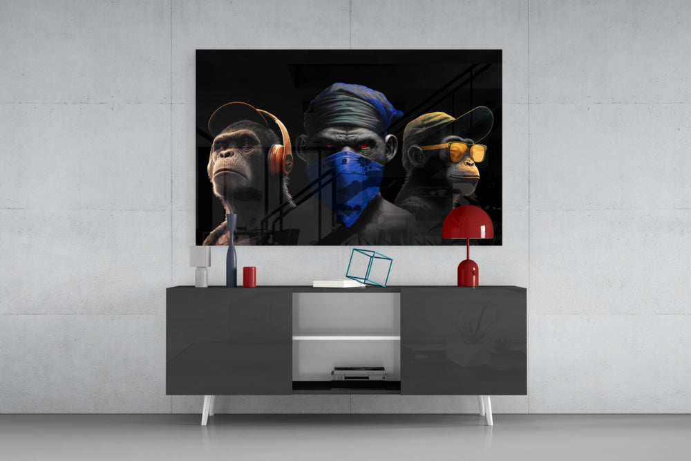 Wise Monkeys panel catching lamp light to reveal its hear-speak-see trio